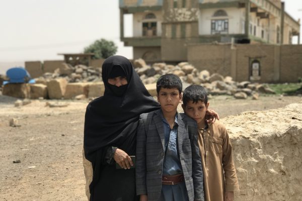 Shafeeqa Eid with her two children in Amran Governorate. She lost her husband this Ramadan to sickness and is now the sole breadwinner for her family, working as a day laborer at nearby farms. She received UNHCR rental assistance to help her and her family cope in exile as they struggle to pay the rent and keep a roof over their heads. ; UNHCR is responding to the humanitarian crisis in Yemen, providing emergency assistance to those forcibly displaced by the conflict. Recent fighting in Yemen has made years of poverty and insecurity even worse. The conflict has disrupted millions of lives, with 2 million internally displaced and a further 1 million having returned home to dangerous conditions. More than 20 million Yemenis need humanitarian assistance. UNHCR provides emergency shelter and household assistance including mattresses, blankets, sleeping mats, kitchen sets, buckets and other essential items. Our assistance has reached people in all 20 governorates affected by the conflict. We also refurbish public buildings that now host displaced families. We provide legal and financial assistance as well as psycho-social support, and we continue to protect and support some 280,000 refugees, mainly from the Horn of Africa, who remain in Yemen despite the conflict.