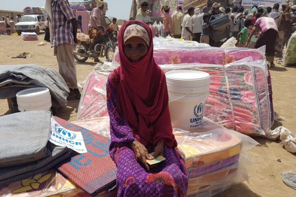 Thousands of displaced Yemenis from villages in the district of Mokha receive mattresses, sleeping mats, blankets, kitchen sets and wash buckets at a UNHCR distribution point. ; After weeks of negotiations, UNHCR reached the district of Mokha in Yemen’s western governorate of Taizz on 20 March 2017. Hostilities between the warring parties have escalated here since the beginning of the year and the intensified fighting has led to tens of thousands being forcibly displaced. UNHCR teams distributed emergency aid to over 3,400 people in the first few days after gaining access. Many are traumatised and living in desperate conditions, lacking water and sanitation. At the time these pictures were taken, two million people were displaced across Yemen and one million had returned home to precarious conditions. Despite the desperate human suffering, by late-March 2017 UNHCR had received less than $10 million of the $99 million it needs to respond to the looming humanitarian catastrophe. We are appealing for urgent international support.