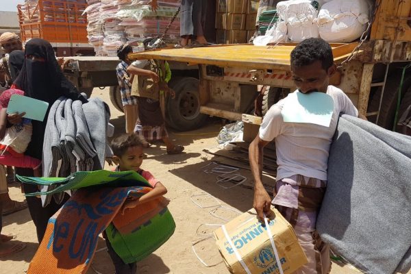 Thousands of displaced Yemenis from villages in the district of Mokha receive mattresses, sleeping mats, blankets, kitchen sets and wash buckets at a UNHCR distribution point. ; After weeks of negotiations, UNHCR reached the district of Mokha in Yemen’s western governorate of Taizz on 20 March 2017. Hostilities between the warring parties have escalated here since the beginning of the year and the intensified fighting has led to tens of thousands being forcibly displaced. UNHCR teams distributed emergency aid to over 3,400 people in the first few days after gaining access. Many are traumatised and living in desperate conditions, lacking water and sanitation. At the time these pictures were taken, two million people were displaced across Yemen and one million had returned home to precarious conditions. Despite the desperate human suffering, by late-March 2017 UNHCR had received less than $10 million of the $99 million it needs to respond to the looming humanitarian catastrophe. We are appealing for urgent international support.