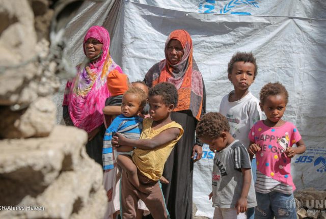 Yemen. Internally displaced by conflict and living in Sana'a Displaced Yemeni mother, Gabra (in pink) and her family, in a hosting site in Sana'a. ; After five years of conflict, Yemen still remains the world’s largest humanitarian crisis with over 24 million in need of assistance and more than 3.6 million people uprooted from their homes. Many internally displaced people (IDPs) fled their homes without taking any belongings or identity documents – including their children’s birth certificates. Now, without legal documentation, many are unable to enrol their children in school, or access basic and essential services, including health care, while others are left vulnerable and at risk of forced eviction.